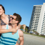 Couple in front of Forest Dunes Resort